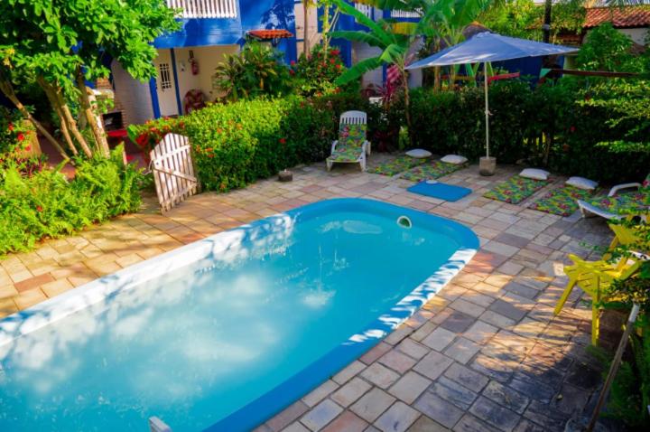 Piscina simples ao ar livre em chalés em Porto de Galinhas