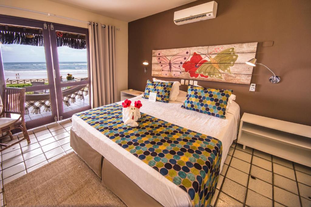 Quarto amplo de casal com varanda com vista para o mar em Porto de Galinhas