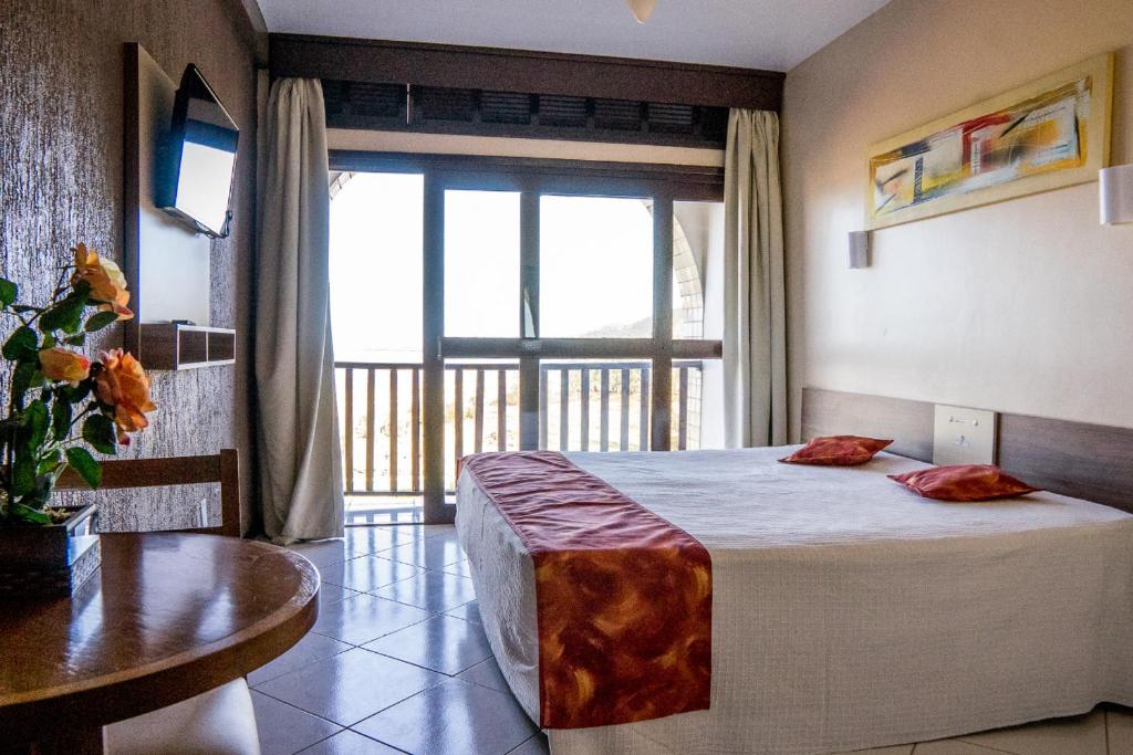 Quarto elegante de casal em pousada em Laguna SC