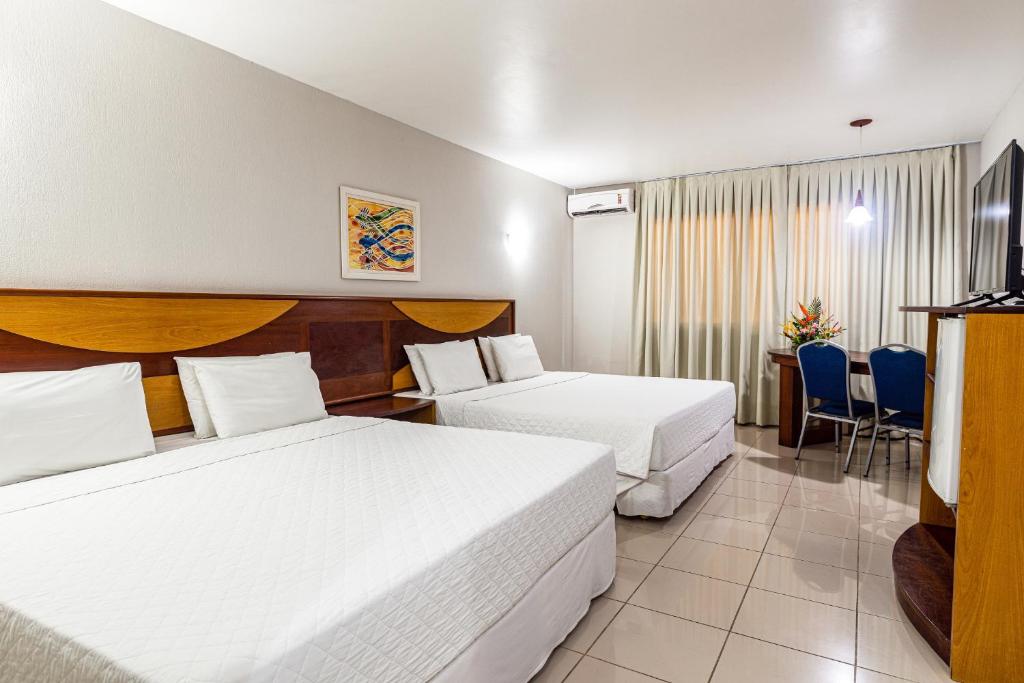 Quarto com duas camas de casal espaçoso em resort em Porto Seguro