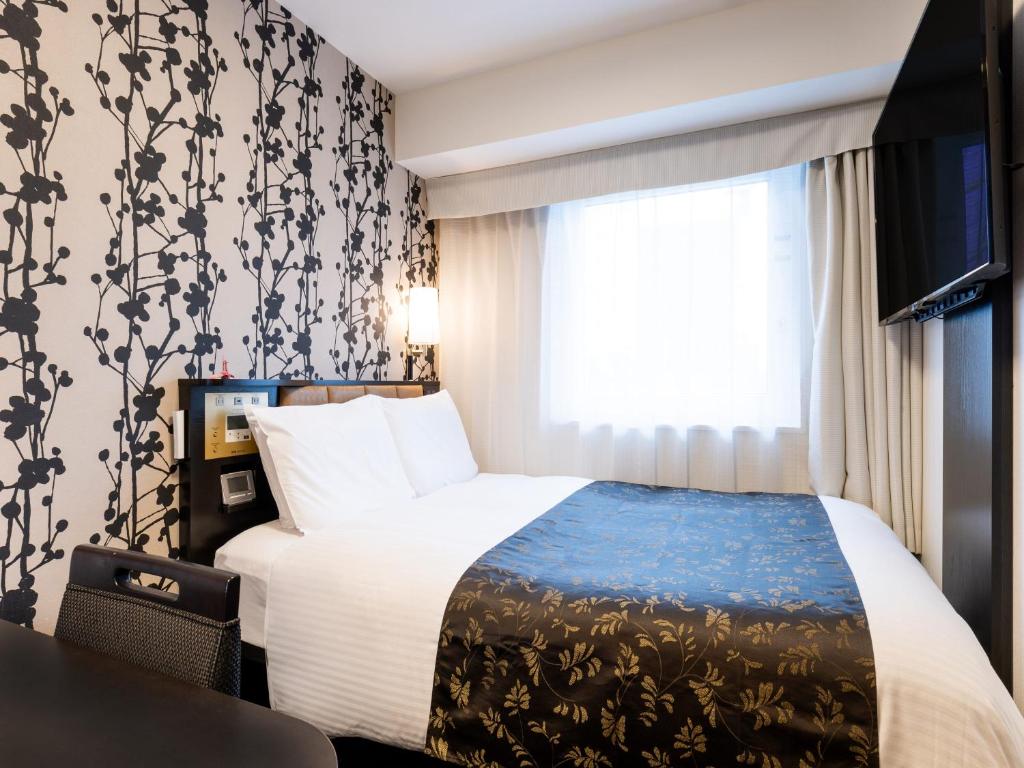 Quarto compacto do APA Hotel and Resort Midosuji Hommachi Ekimae Tower em Osaka
